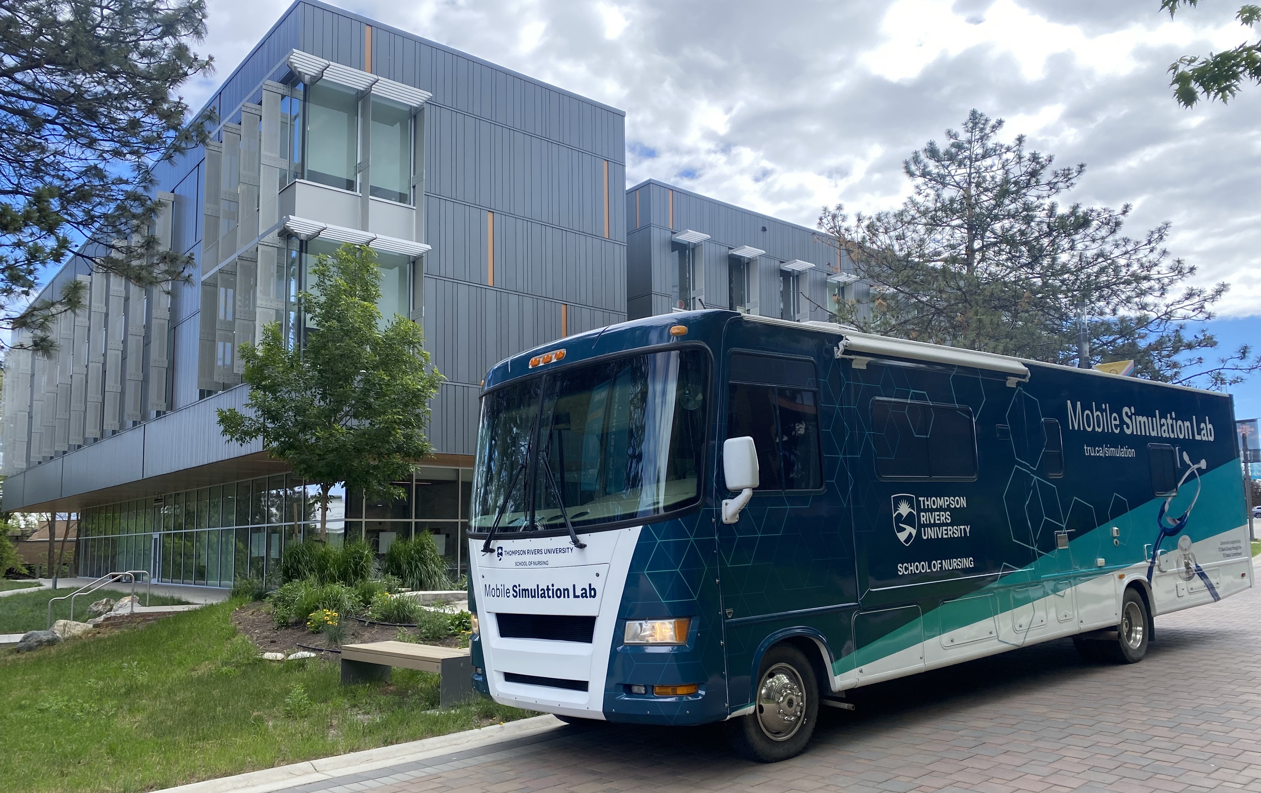 Photo of mobile simulation lab in front of nursing building